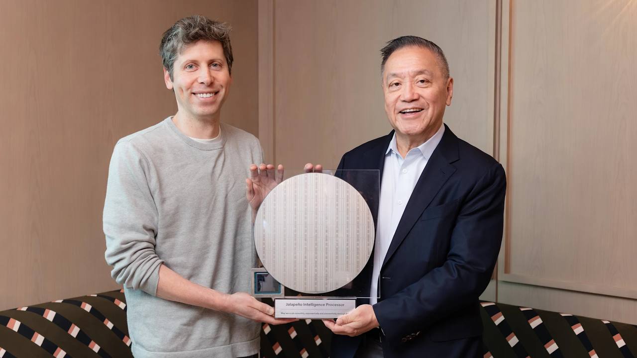 Sam Altman and Hock Tan holding a silicon wafer mounted on a base engraved Jalapeno Intelligence Processor